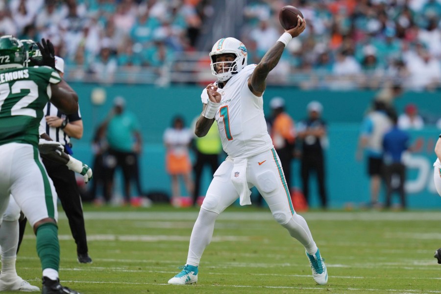 Miami Dolphins quarterback Tua Tagovailoa (1) aims a pass during the first half of an NFL football game against the New York Jets, Sunday, Dec. 8, 2024, in Miami Gardens, Fla. (AP Photo/Lynne Sladky)