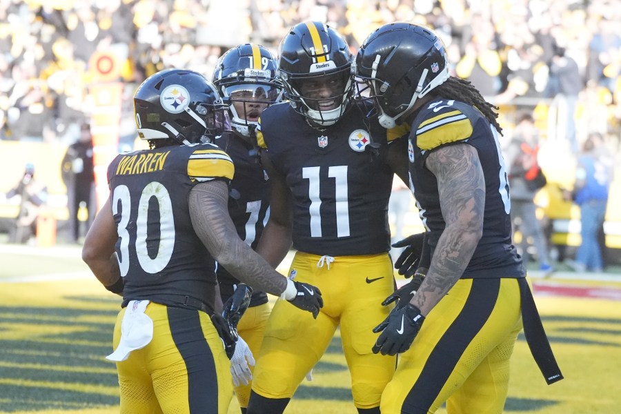 Pittsburgh Steelers wide receiver Van Jefferson (11) celebrates his touchdown against the Cleveland Browns with teammates Jaylen Warren (30), Calvin Austin III (19), and MyCole Pruitt, right, in the second half of an NFL football game in Pittsburgh, Sunday, Dec. 8, 2024. (AP Photo/Gene J. Puskar)