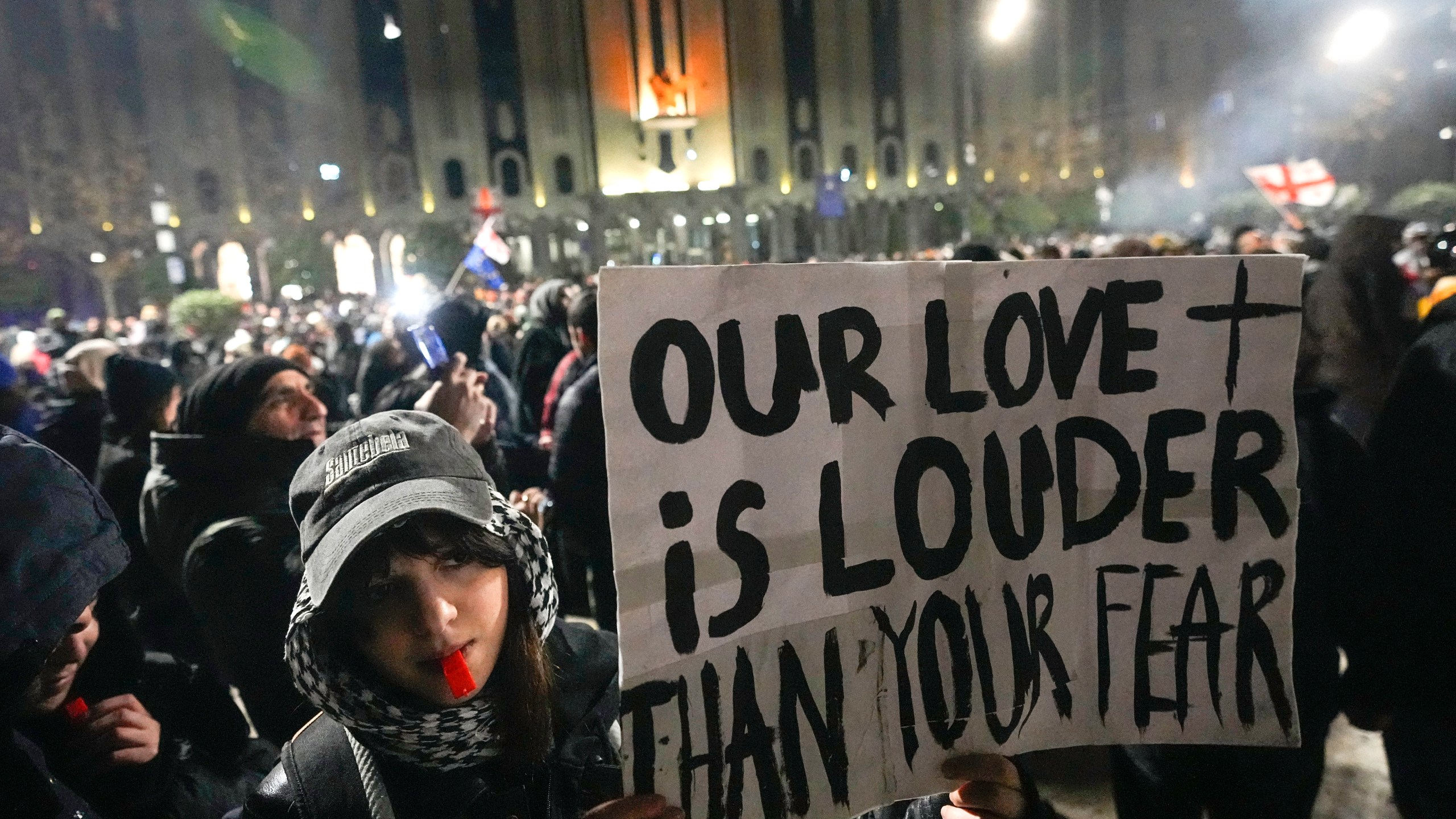 Demonstrators rally outside the parliament to protest against the government's decision to suspend negotiations on joining the European Union in Tbilisi, Georgia, Sunday, Dec. 8, 2024. (AP Photo/Pavel Bednyakov)