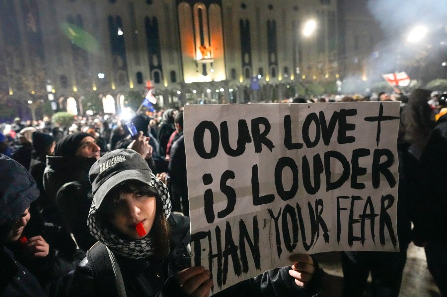 Demonstrators rally outside the parliament to protest against the government's decision to suspend negotiations on joining the European Union in Tbilisi, Georgia, Sunday, Dec. 8, 2024. (AP Photo/Pavel Bednyakov)