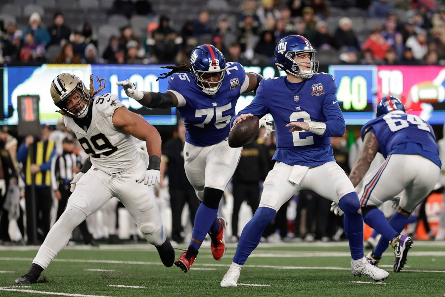New York Giants quarterback Drew Lock (2) passes against the New Orleans Saints during the fourth quarter of an NFL football game, Sunday, Dec. 8, 2024, in East Rutherford, N.J. (AP Photo/Adam Hunger)
