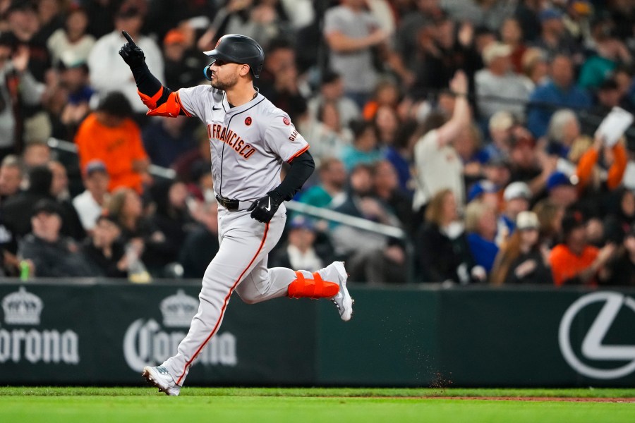 FILE - San Francisco Giants' Michael Conforto runs the bases after hitting a two-run home run to score Heliot Ramos against the Seattle Mariners during the fourth inning of a baseball game, Aug. 23, 2024, in Seattle. (AP Photo/Lindsey Wasson, File)