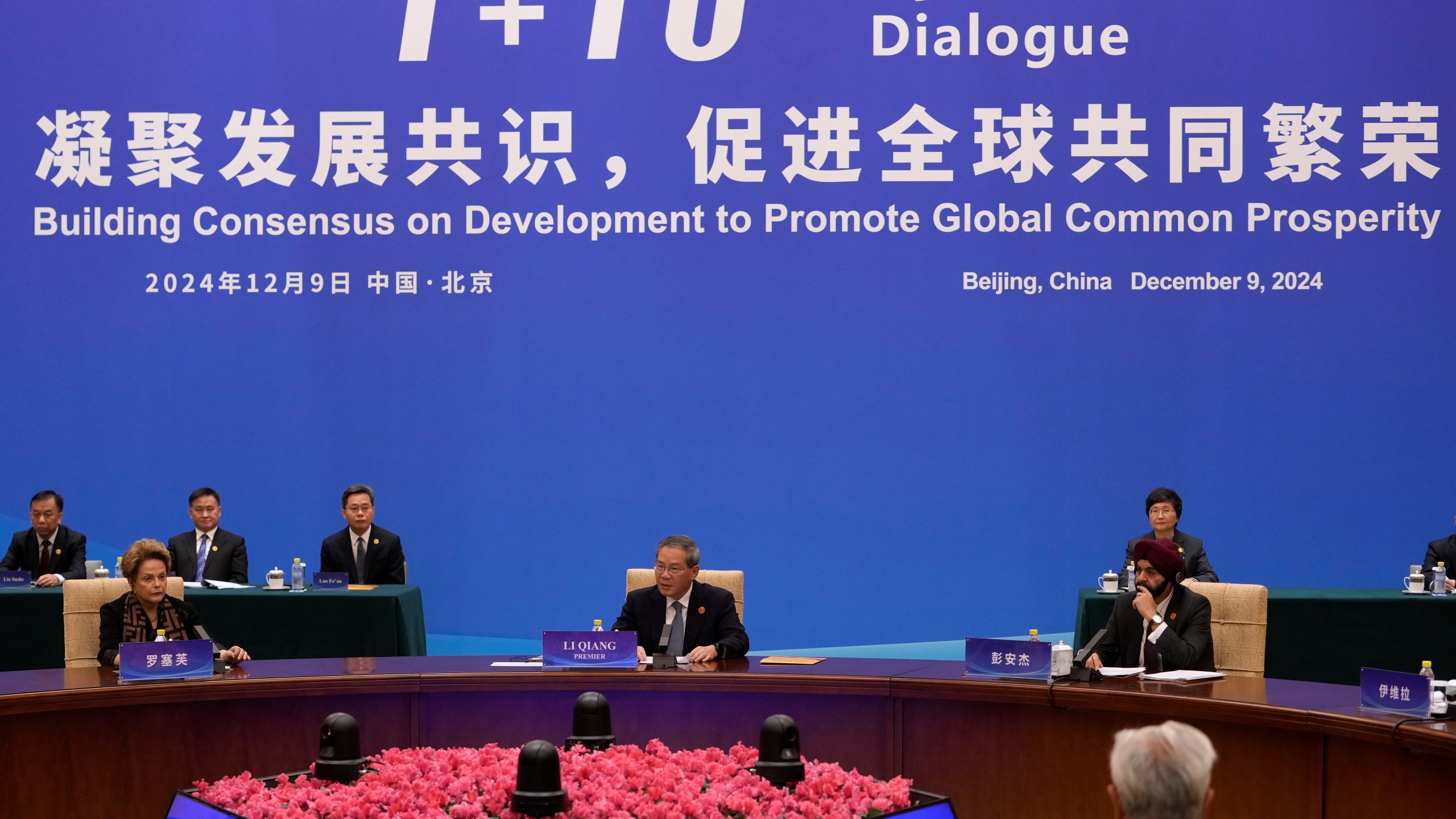 Chinese Premier Li Qiang, center, speaks as he chairs the "1+10" Dialogue on Building Consensus on Development to Promote Global Common Prosperity, at the Diaoyutai State Guesthouse in Beijing, Monday, Dec. 9, 2024. (AP Photo/Andy Wong)