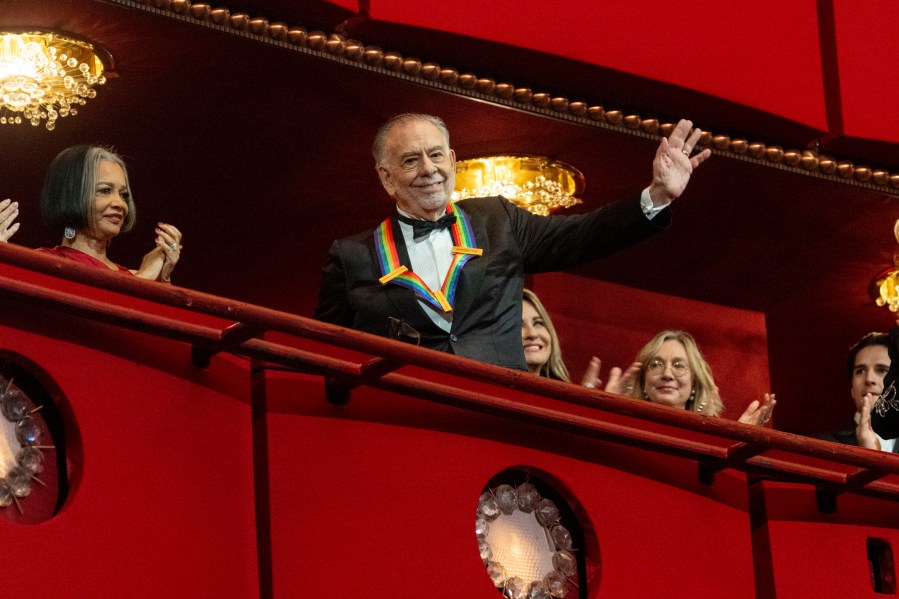 2024 Kennedy Center Honoree, director and filmmaker Francis Ford Coppola waves to the audience at the start of the Kennedy Center Honors Gala, Sunday, Dec. 8, 2024, in Washington. (AP Photo/Kevin Wolf)