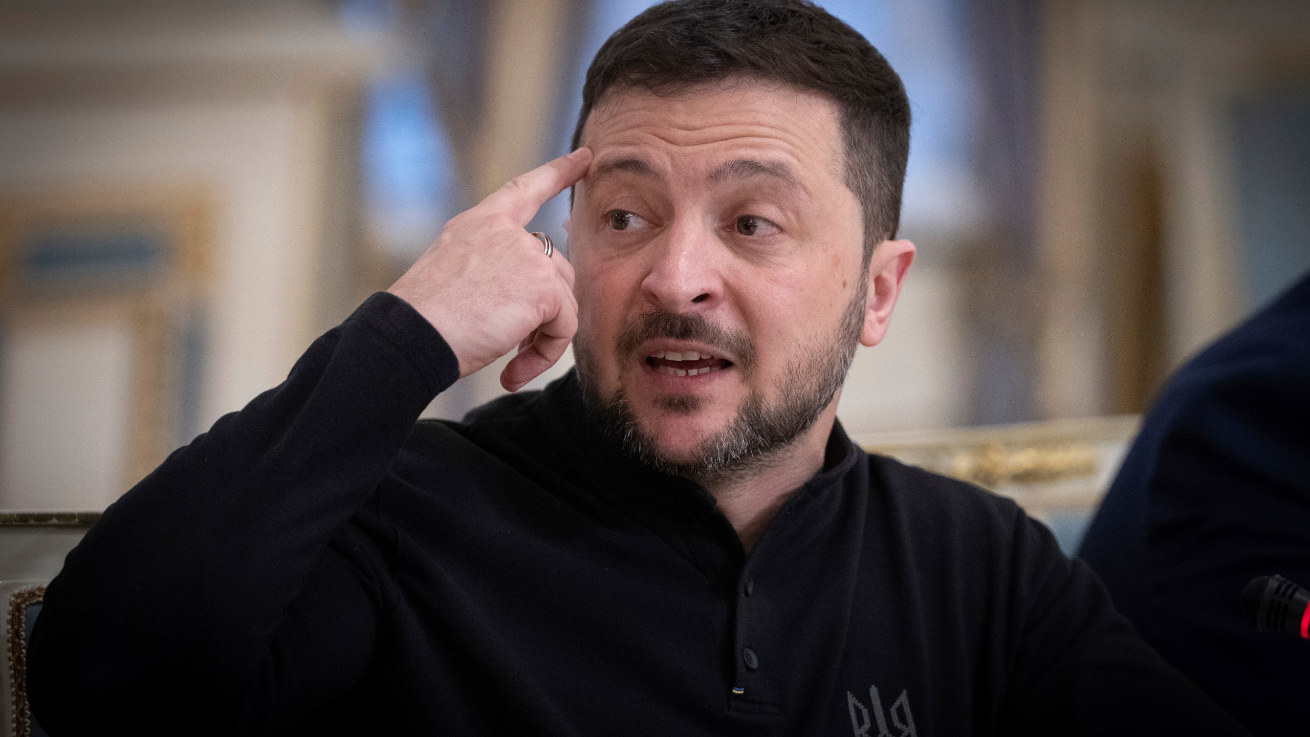 Ukrainian President Volodymyr Zelenskyy talks during his meeting with Chairman of the German Christian Democratic Party (CDU) Friedrich Merz in Kyiv, Ukraine, Monday, Dec. 9, 2024. (AP Photo/Efrem Lukatsky).