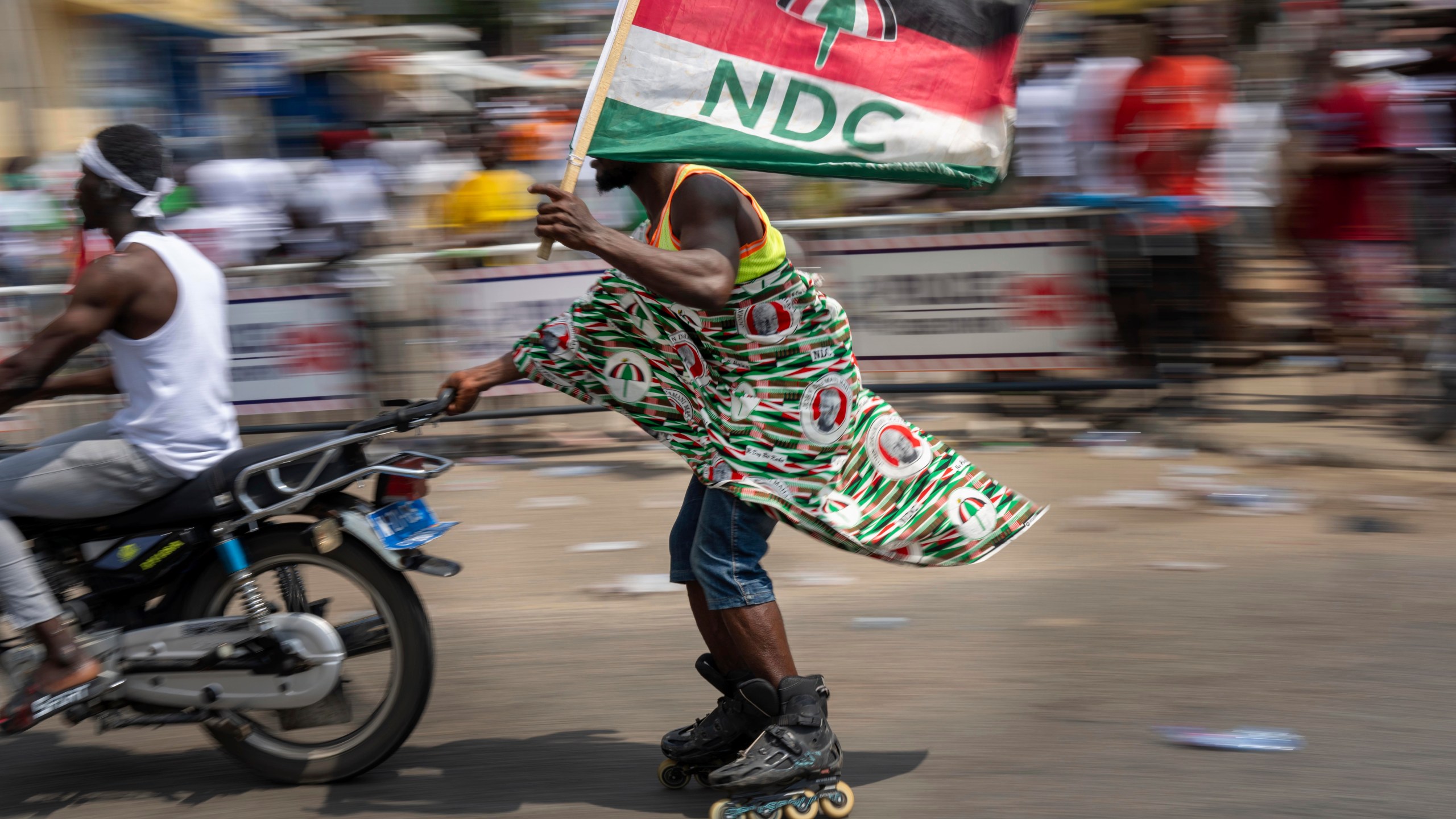 Supporters of opposition candidate and former President John Dramani Mahama celebrate his victory after his opponent conceded in Accra, Ghana, Sunday, Dec. 8, 2024. (AP Photo/Jerome Delay)
