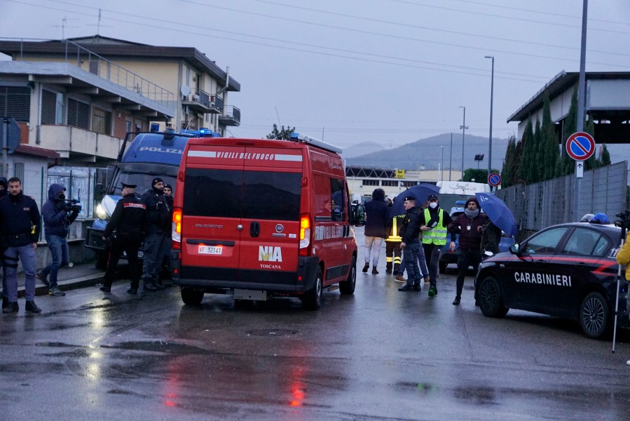 Emergency services work on a site of a fuel depot's explosion in Calenzano, near Florence, Italy, Monday, Dec. 9, 2024. (Alessandro La Rocca/LaPresse via AP)