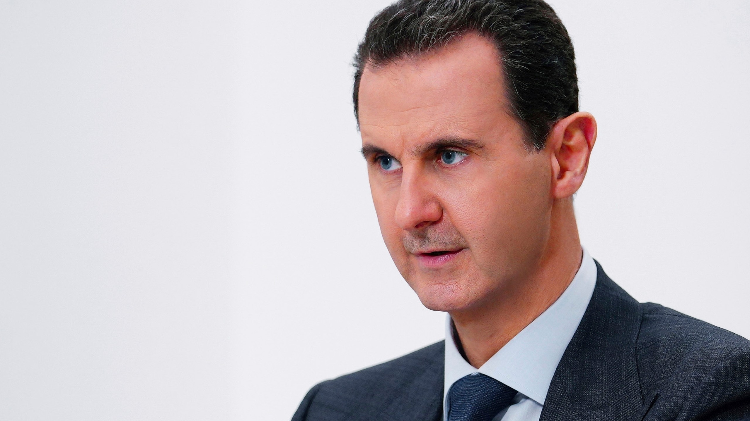 FILE - In this photo provided Nov. 9, 2019, by the official Syrian news agency SANA, Syrian President Bashar Assad speaks in Damascus, Syria. (SANA via AP, File)