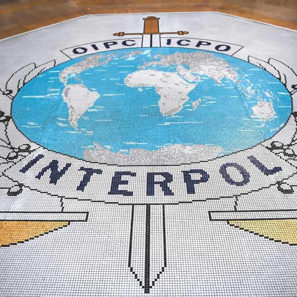 The logo of the International Criminal Police Organization, known as Interpol.
