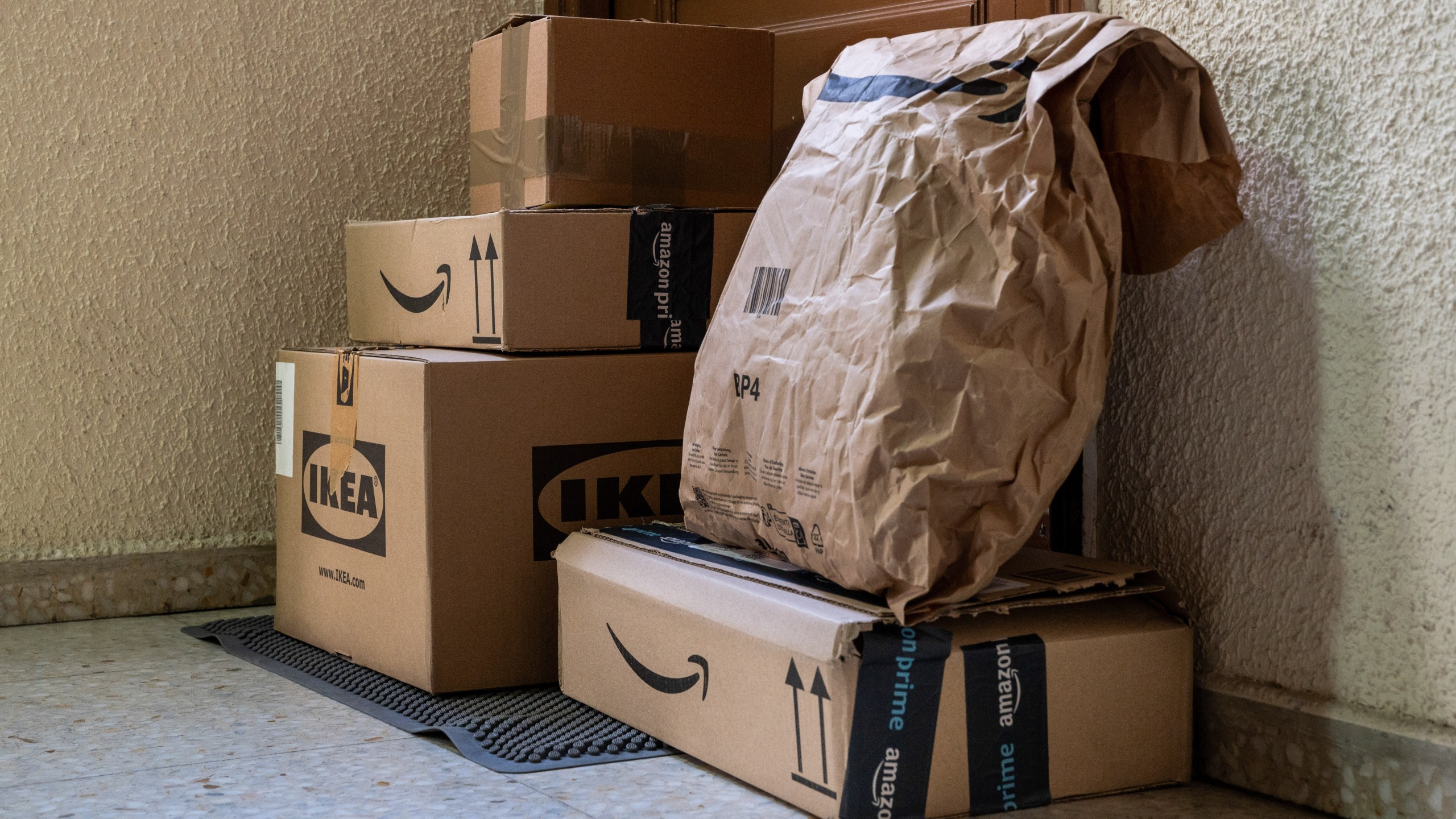 Online purchases from the retail companies in front of a customer's door.