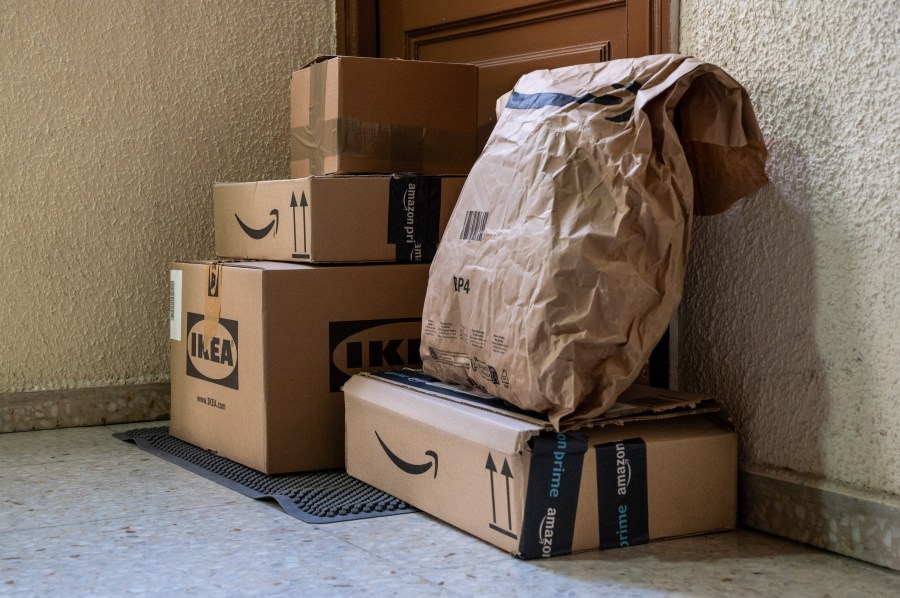 Online purchases from the retail companies in front of a customer's door.